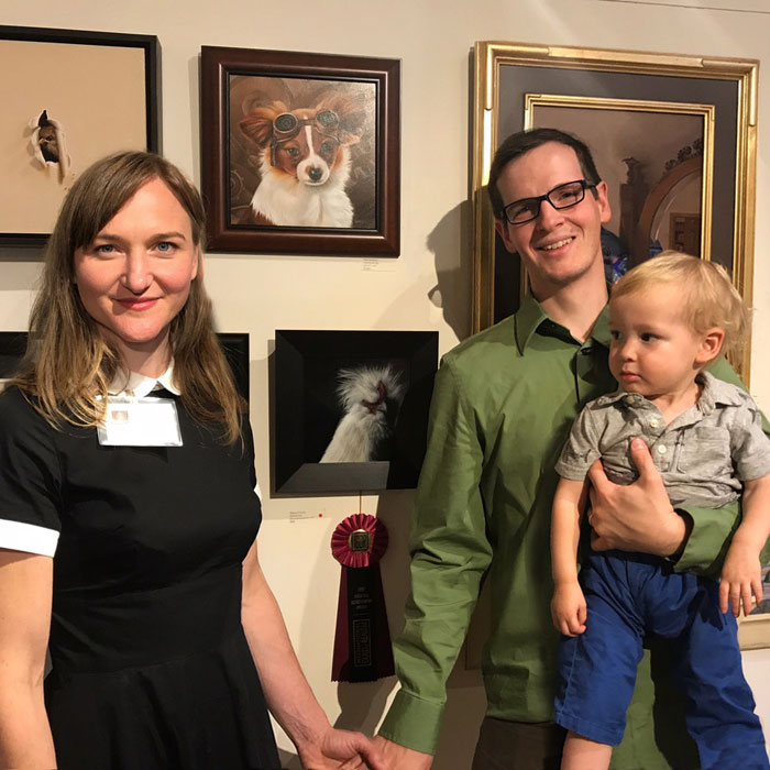 Artist Rebecca Luncan at art opening with her family