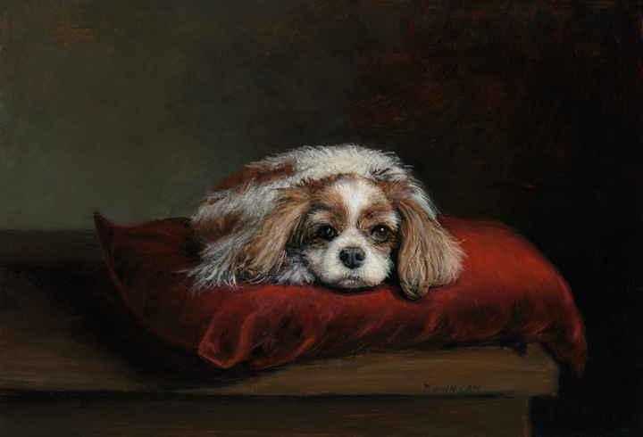 Oil painting of a Blenheim Cavalier King Charles Spaniel named Betty, posed on a red velvet cushion atop a wooden table with a dark background by Rebecca Luncan